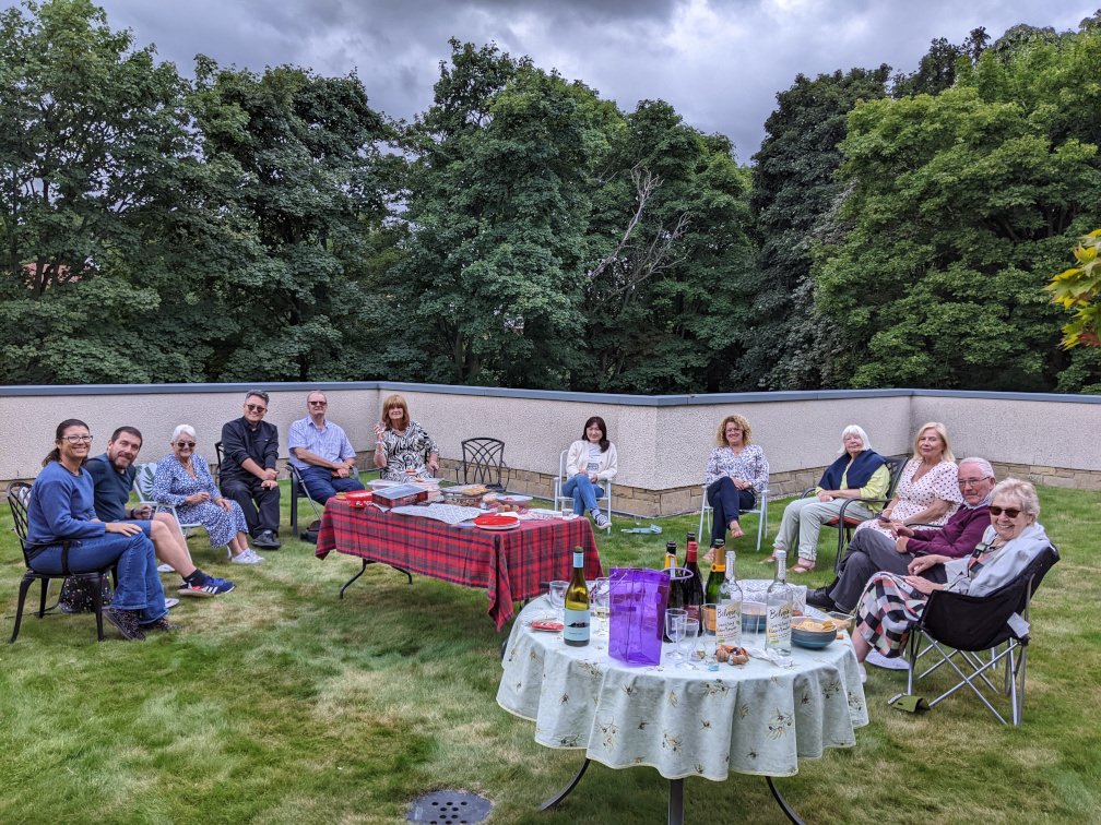 Empty tables and guests seated to relax and converse.
